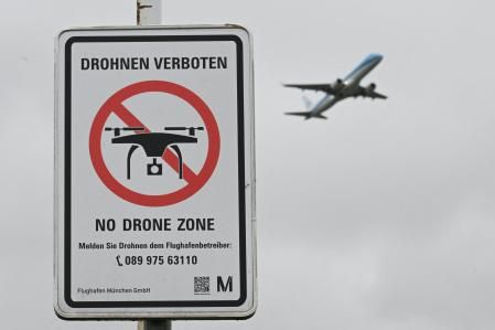 A sign with a drone ban is displayed outside the airport in Munich, Germany October 6, 2025.