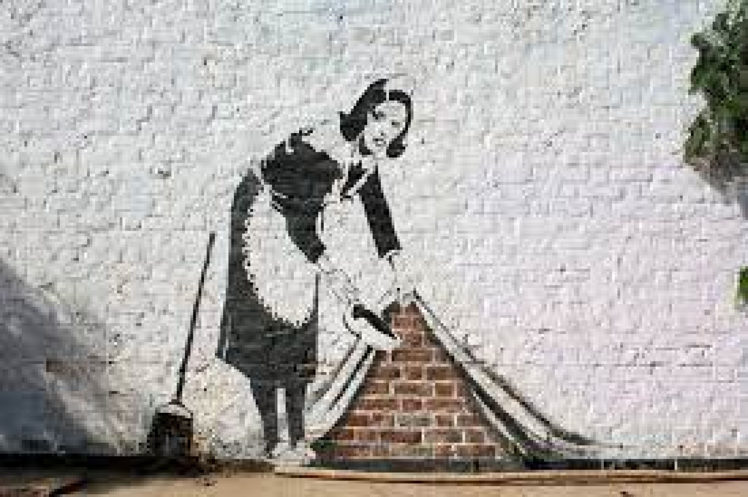 Sweep it under the carpet - Banksy. Una de las piezas más reconocidas de Banksy en 2006. Muestra a una mujer vestida de sirvienta que está barriendo la suciedad al amparo de una pared de ladrillos. Se dice que la pieza representa al mundo occidental para hacer frente a problemas globales como la epidemia de sida como tema principal en 2006.