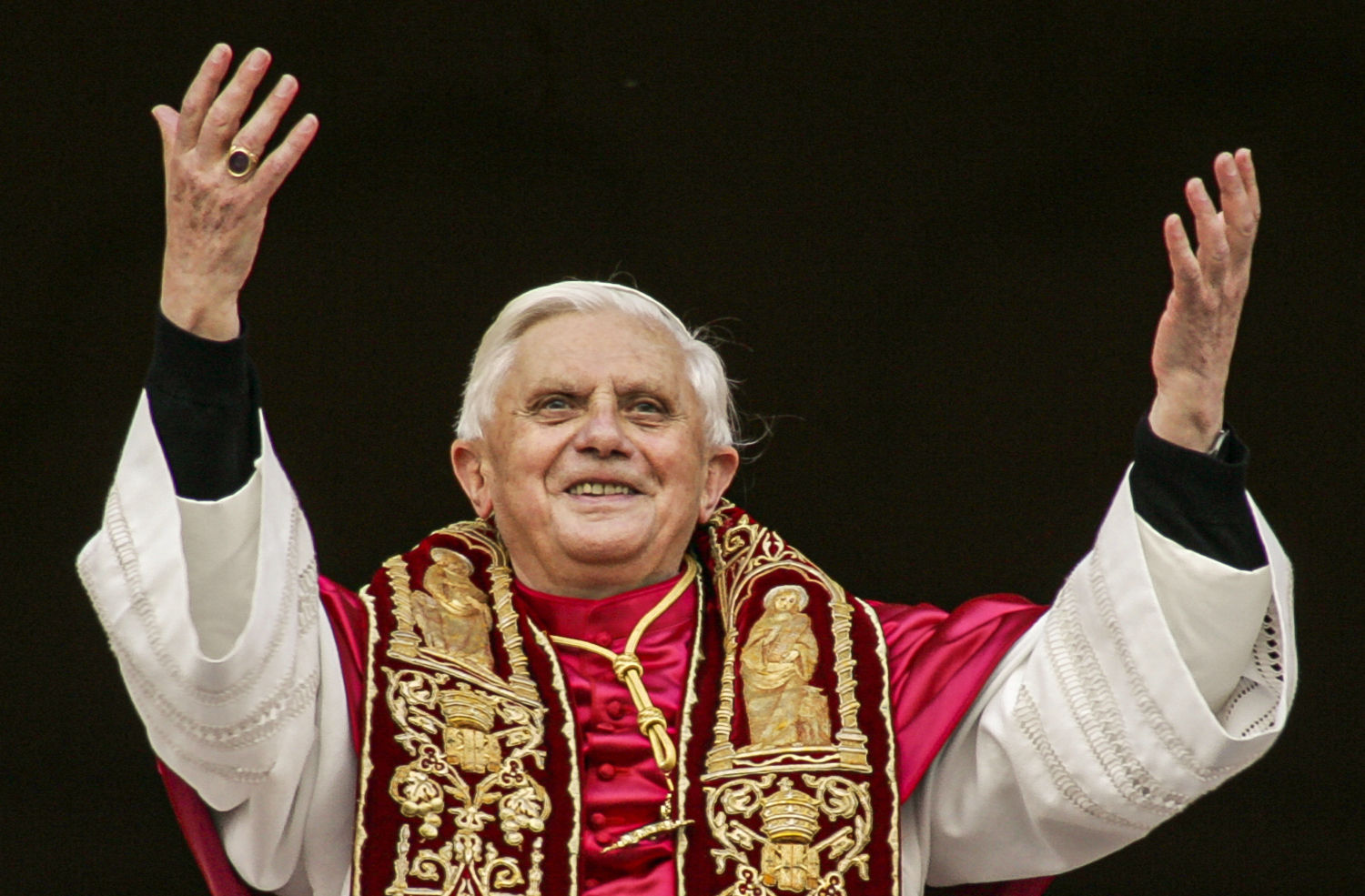 FILE - Pope Benedict XVI greets the crowd from the central balcony of St. Peter's Basilica at the Vatican on April 19, 2005, soon after his election. (AP Photo/Andrew Medichini, File)