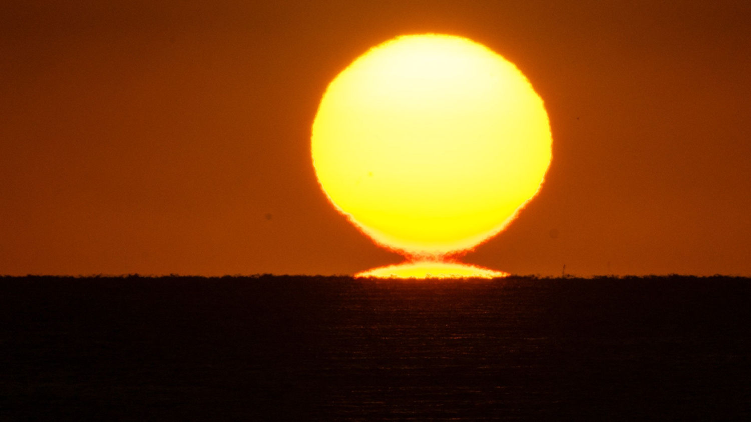 El sol duplicado visto desde El Portitxol.