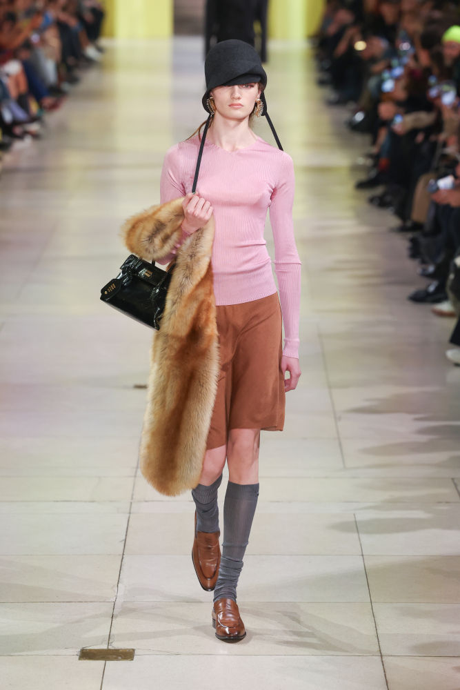 PARIS, FRANCE - MARCH 11: (EDITORIAL USE ONLY - For Non-Editorial use please seek approval from Fashion House) A model walks the runway during the Miu Miu Womenswear Fall/Winter 2025-2026 show as part of Paris Fashion Week at Palais d'Iena on March 11, 2025 in Paris, France. (Photo by Victor Boyko/Getty Images)