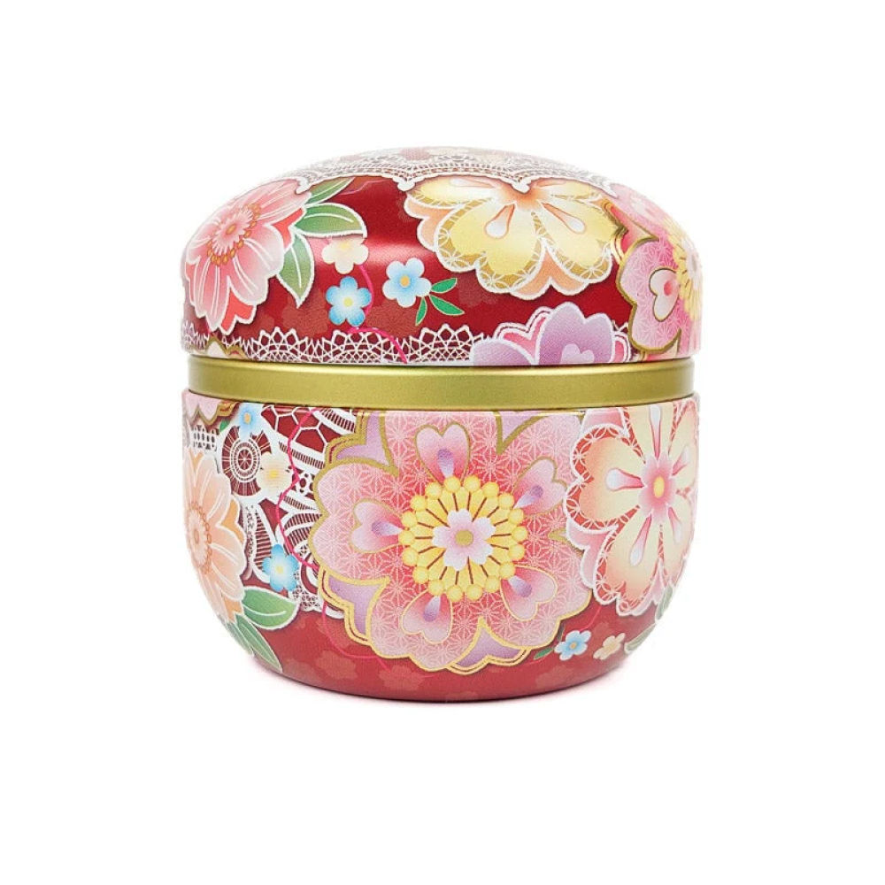 Latas de té metálicas. La cilíndrica está recubierta de papel washi