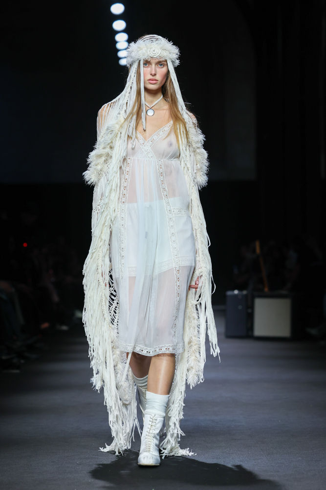 A model presents a creation by Miu Miu for the Women Ready-to-wear Spring-Summer 2026 collection as part of the Paris Fashion Week, in Paris on October 6, 2025. (Photo by JULIEN DE ROSA / AFP)