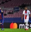 BARCELONA, SPAIN - FEBRUARY 16: Lionel Messi of FC Barcelona reacts as Kylian Mbappe of Paris Saint-Germain looks on after celebrating his side's fourth goal during the UEFA Champions League Round of 16 match between FC Barcelona and Paris Saint-Germain at Camp Nou on February 16, 2021 in Barcelona, Spain. Sporting stadiums around Spain remain under strict restrictions due to the Coronavirus Pandemic as Government social distancing laws prohibit fans inside venues resulting in games being played behind closed doors. (Photo by David Ramos/Getty Images)