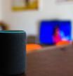 Rome, Italy, april 2020. Alexa smart home assistant device by Amazon close up connected in house living room selective focus background