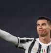 (FILES) In this file photo taken on February 09, 2021 Juventus' Portuguese forward Cristiano Ronaldo reacts during the Italian Cup semifinal second leg football match beetween Juventus Turin and Inter Milan at the Juventus stadium in Turin. - Premier League champions Manchester City were reported to be closing in on a deal late on August 26, 2021 to bring Portuguese superstar Cristiano Ronaldo back to England. (Photo by Marco BERTORELLO / AFP)
