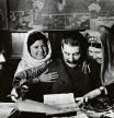 Soviet leader Joseph Stalin autographs photographs for 11-year-old Mamlakat Nakhangova (left of Stalin) and Ene Geldiyeva (right), members of a farming collective from Tajikistan who went to Moscow to confer with Stalin. M.A. Chernov, the people's commissar for agriculture, is at the far left. (Photo by © Hulton-Deutsch Collection/CORBIS/Corbis via Getty Images)