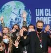 Delegates pose for a picture during the UN Climate Change Conference (COP26) in Glasgow, Scotland, Britain November 13, 2021. REUTERS/Yves Herman
