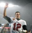(FILES) In this file photo taken on October 03, 2021, Tom Brady, #12 of the Tampa Bay Buccaneers, waves to the crowd as he runs off the field after defeating the New England Patriots in the game at Gillette Stadium in Foxborough, Massachusetts. - Seven-time Super Bowl champion quarterback Tom Brady will retire after 22 NFL seasons, according to multiple US media reports Saturday. (Photo by Maddie Meyer / GETTY IMAGES NORTH AMERICA / AFP)
