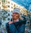 CHUHUIV, UKRAINE - FEBRUARY 24: (EDITORS NOTE: Image depicts graphic content) A wounded woman is seen after an airstrike damaged an apartment complex in city of Chuhuiv, Kharkiv Oblast, Ukraine on February 24, 2022. (Photo by Wolfgang Schwan/Anadolu Agency via Getty Images)