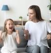 Stubborn little girl scream loud not listening to strict mom, serious young mother scold shouting daughter for bad behavior, working mommy lecture kid yelling asking attention. Family conflict concept