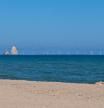 Recreación de como se verán los molinos desde l'Estartit, según los promotores del parque eólico marino Tramuntana.