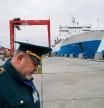FILE PHOTO: A Russian customs officer works at a commercial port in the Baltic Sea town of Baltiysk in the Kaliningrad region, Russia October 28, 2021. REUTERS/Vitaly Nevar/File Photo