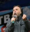 Russian politologist Alexander Dugin gestures as he addresses the rally 