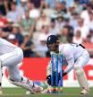 South Africa's Rassie van der Dussen plays a defensive shot as England's Ben Foakes keeps wicket on day 3 of the second Test match between England and South Africa at the Old Trafford cricket ground in Manchester, north-west England on August 27, 2022. (Photo by Lindsey Parnaby / AFP) / RESTRICTED TO EDITORIAL USE. NO ASSOCIATION WITH DIRECT COMPETITOR OF SPONSOR, PARTNER, OR SUPPLIER OF THE ECB