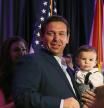 WEST PALM BEACH, FL - OCTOBER 06: Republican gubernatorial candidate Ron DeSantis holds his son, Mason DeSantis, as he arrives to speak during a campaign rally at the Palm Beach County Convention Center on October 6, 2018 in West Palm Beach, Florida. DeSantis is facing off against Democratic challenger Andrew Gillum to be the next Florida governor. (Photo by Joe Raedle/Getty Images)