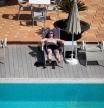 A tourist rests by the swimming pool at Acapulco Playa hotel in Palma de Mallorca on March 29, 2021 - After the German Chancellor, Angela Merkel, refused in extremis to impose a strict confinement during this Easter to put an end to contagions by covid-19, tourist reservations soared when the German government lifted the obligation to keep quarantine upon return from the Balearic Islands, thanks to the low incidence of the virus in this Spanish Mediterranean archipelago so appreciated by the Germans. (Photo by JAIME REINA / AFP)