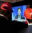 FILE - Supporters wait to hear U.S. Senate candidate Herschel Walker speak during an election night watch party as they watch TV host Tucker Carlson, May 24, 2022, in Atlanta. Fox News says it has agreed to part ways with Tucker Carlson, less than a week after settling a lawsuit over the network’s 2020 election reporting. (AP Photo/Brynn Anderson, File)