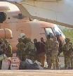This undated photograph handed out by French military shows Russian mercenaries boarding a helicopter in northern Mali. Russia's Wagner Group, a private military company led by Yevgeny Prigozhin, has played a key role in the fighting in Ukraine and also deployed its personnel to Syria, Central African Republic, Libya and Mali. (French Army via AP, File)