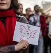 A demonstrator displays a card with a dove of peace during a rally in solidarity with the Palestinians in the Gaza Strip in Warsaw, Poland on October 29, 2023. Thousands of civilians, both Palestinians and Israelis, have died since October 7, 2023, after Palestinian Hamas militants based in the Gaza Strip entered southern Israel in an unprecedented attack triggering a war declared by Israel on Hamas with retaliatory bombings on Gaza. (Photo by Wojtek RADWANSKI / AFP)