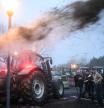 Farmers use agricultural vehicles to throw straw and manure at the DRAAF Bretagne (Regional direction of food, agriculture and forests) building during a demonstration called by the main farmers unions to protest against 