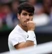 Spain's Carlos Alcaraz celebrates winning a point against France's Ugo Humbert during their men's singles fourth round tennis match on the seventh day of the 2024 Wimbledon Championships at The All England Lawn Tennis and Croquet Club in Wimbledon, southwest London, on July 7, 2024. (Photo by HENRY NICHOLLS / AFP) / RESTRICTED TO EDITORIAL USE