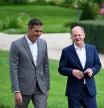 German Chancellor Olaf Scholz (R) and Spanish Prime Minister Pedro Sanchez take a walk in the garden during a closed meeting of the German cabinet on August 30, 2022 at Schloss Meseberg palace in Meseberg near Gransee, northeastern Germany. (Photo by Tobias SCHWARZ / AFP)
