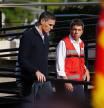 Spanish Prime Minister Pedro Sanchez (L) arrives to preside a meeting of the government's crisis committee next to Valencia Regional President Carlos Mazon in L'Eliana on October 31, 2024. Rescuers raced on October 31, 2024 to find survivors and victims of once-in-a-generation floods in Spain that killed at least 95 people and left towns submerged in a muddy deluge with overturned cars scattered in the streets. About 1,000 troops joined police and firefighters in the grim search for bodies in the Valencia region as Spain started three days of mourning. Up to a year's rain fell in a few hours on the eastern city of Valencia and surrounding region on October 29 sending torrents of water and mud through towns and cities. (Photo by Manaure Quintero / AFP)