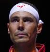 Spain's tennis player Rafael Nadal during the national anthem ahead of a Davis Cup quarterfinal match against Netherlands' Botic Van De Zandschulp at Martin Carpena Sports Hall in Malaga, southern Spain, on Tuesday, Nov. 19, 2024. (AP Photo/Manu Fernandez)