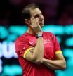 TOPSHOT - Spain's Rafael Nadal cries as he attends a tribute to his career at the end of the quarter-final doubles match between Netherlands and Spain during the Davis Cup Finals at the Palacio de Deportes Jose Maria Martin Carpena arena in Malaga, southern Spain, on November 19, 2024. Superstar Rafael Nadal's glittering career in professional tennis came to an end on November 19, 2024 as Netherlands eliminated Spain in the Davis Cup quarter-finals. (Photo by Thomas COEX / AFP)