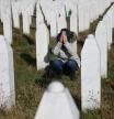A woman reacts near a grave of her family members in the Memorial centre Potocari near Srebrenica, Bosnia and Herzegovina, after the court proceedings of former Bosnian Serb general Ratko Mladic, November 22, 2017. REUTERS/Dado Ruvic