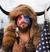 FILE PHOTO: Jacob Anthony Chansley, also known as Jake Angeli, of Arizona, poses with his face painted in the colors of the U.S. flag as supporters of U.S. President Donald Trump gather in Washington, U.S. January 6, 2021. REUTERS/Stephanie Keith/File Photo