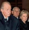 (FILES) In this file photo taken on January 29, 2020 Spain's former king Juan Carlos I (L) and his wife Sofia attend the funeral for Juan Carlos' sister Infanta Pilar of Spain, at the basilica of the Royal Site of San Lorenzo of El Escorial in San Lorenzo del Escorial. - Spain's scandal-hit former king Juan Carlos I, who now lives in exile, has settled a debt of nearly 4.4 million euros ($5.4 million) with the Spanish tax authorities, his lawyer said on February 26, 2021. The back taxes were due on the value of private jet flights that were paid by a foundation based in Liechtenstein belonging to a distant cousin that are considered taxable income. (Photo by EMILIO NARANJO / AFP)