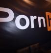 (FILES) In this file photo taken on January 23, 2018 a Pornhub logo is displayed at the company's booth at the 2018 AVN Adult Entertainment Expo at the Hard Rock Hotel & Casino in Las Vegas, Nevada. - Credit card titans Visa and Mastercard on December 10 said they would no longer process payments to Pornhub after US media reported the site hosts videos depicting child sex abuse and rape. (Photo by Ethan Miller / GETTY IMAGES NORTH AMERICA / AFP)