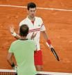 PARIS, FRANCE - JUNE 11: Novak Djokovic of Serbia (Top) shakes hands with Rafael Nadal of Spain after winning their Men's Singles Semi Final match against on day Thirteen of the 2021 French Open at Roland Garros on June 11, 2021 in Paris, France. (Photo by Clive Brunskill/Getty Images)