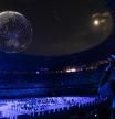Tokyo (Switzerland), 23/07/2021.- A photographer takes pictures of drones forming a globe in the sky over the stadium during the opening ceremony of the 2020 Tokyo Summer Olympics at the National Stadium in Tokyo, Japan, 23 July 2021. (Japón, Tokio) EFE/EPA/PETER KLAUNZER