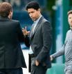 TOPSHOT - PSG's Brazilian sporting director Leonardo (L) speaks with president Nasser Al-Khelaifi as Paris Saint-Germain's Argentinian forward Lionel Messi arrives for a training session at the club's Camp des Loges training ground in Saint-Germain-en-Laye on September 27, 2021. (Photo by FRANCK FIFE / AFP)