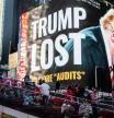 A billboard showing former U.S. President Donald Trump is seen as people visit Times Square in the Manhattan borough of New York, New York, U.S., October 14, 2021. REUTERS/Eduardo Munoz