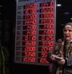 Istanbul (Turkey), 02/12/2021.- A woman checks rates on a board of the currency exchange office in Istanbul, Turkey, 02 December 2021. Turkish President Tayyip Erdogan appointed Nureddin Nebati, a strong supporter of the low interest rate move, as treasury and finance minister on 02 December. Turkish lira hit a new record low level of 13.43 liras to the US Dollar. (Turquía, Estanbul) EFE/EPA/SEDAT SUNA