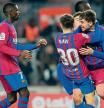 Barcelona's players celebrate their third goal scored by Spanish midfielder Nico Gonzalez (2R) during the Spanish league football match between FC Barcelona and Elche CF at the Camp Nou stadium in Barcelona on December 18, 2021. (Photo by Pau BARRENA / AFP)
