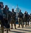 (FILES) In this file photo taken on January 19, 2021, members of the National Guard gather at a security checkpoint near the US Capitol, ahead of the 59th inaugural ceremony for President-elect Joe Biden and Vice President-elect Kamala Harris in Washington, DC. - On January 6, 2021 they descended upon Washington, DC in the thousands, gathering to protest the result of a presidential election they still claim was 