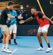 MELBOURNE, AUSTRALIA - JANUARY 21: Nick Kyrgios of Australia and Thanasi Kokkinakis of Australia celebrate match point in their second round doubles match against Nikola Mektic of Croatia and Mate Pavic of Croatia during day five of the 2022 Australian Open at Melbourne Park on January 21, 2022 in Melbourne, Australia. (Photo by Darrian Traynor/Getty Images)