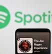 Joe Rogan's Spotify profile is seen in front of displayed Spotify logo in this photo illustration taken, February 7, 2022. REUTERS/Dado Ruvic/Illustration