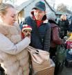 Evacuees gather at a railway station before boarding a train and leaving the rebel-controlled city of Donetsk, Ukraine February 20, 2022. REUTERS/Alexander Ermochenko