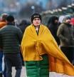 MEDYKA, POLAND - FEBRUARY 25: A Ukrainian wrapped in a blanket waits for relatives to cross the Polish Ukrainian Medyka border crossing on February 25, 2022 in Medyka, Poland. The Ukrainian government issued order to stop 18-60 year-old men legible for military conscription from crossing borders. On February 24, 2022 Russia began a large-scale attack on Ukraine, with Russian troops invading the country from the north, east and south, accompanied by air strikes and shelling. The Ukrainian president said that at least 137 Ukrainian soldiers were killed by the end of the first day. (Photo by Omar Marques/Getty Images)