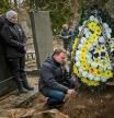 Dmytro cries next to the grave of his father Volodymyr Nezhenets, 54, during his funeral in the city of Kyiv, Ukraine, Friday, March 4, 2022. A small group of reservists are burying their comrade, 54-year-old Volodymyr Nezhenets, who was one of three killed on Feb. 26 in an ambush Ukrainian authorities say was caused by Russian 'saboteurs'. (AP Photo/Emilio Morenatti)