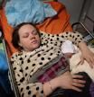 Mariana Vishegirskaya lies in a hospital bed after giving birth to her daughter Veronika, in Mariupol, Ukraine, Friday, March 11, 2022. Vishegirskaya survived the Russian airstrike on a children’s and maternity hospital in Mariupol last Wednesday. (AP Photo/Evgeniy Maloletka)