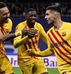 TOPSHOT - Barcelona's Spanish forward Ferran Torres (R) celebrates with Barcelona's Gabonese midfielder Pierre-Emerick Aubameyang (L) and Barcelona's French forward Ousmane Dembele (C) after scoring a goal during the Spanish League football match between Real Madrid CF and FC Barcelona at the Santiago Bernabeu stadium in Madrid on March 20, 2022. (Photo by JAVIER SORIANO / AFP)