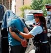 GRAFCAT9556. BARCELONA, 14/07/2020.- Mossos d'esquadra custodian a uno de los detenidos en la operación contra el terrorismo yihadista que llevan a cabo desde primera hora de la mañana en el distrito de Ciutat Vella de Barcelona. EFE/Toni Albir