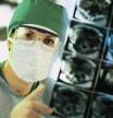 Surgeon examining cat scan